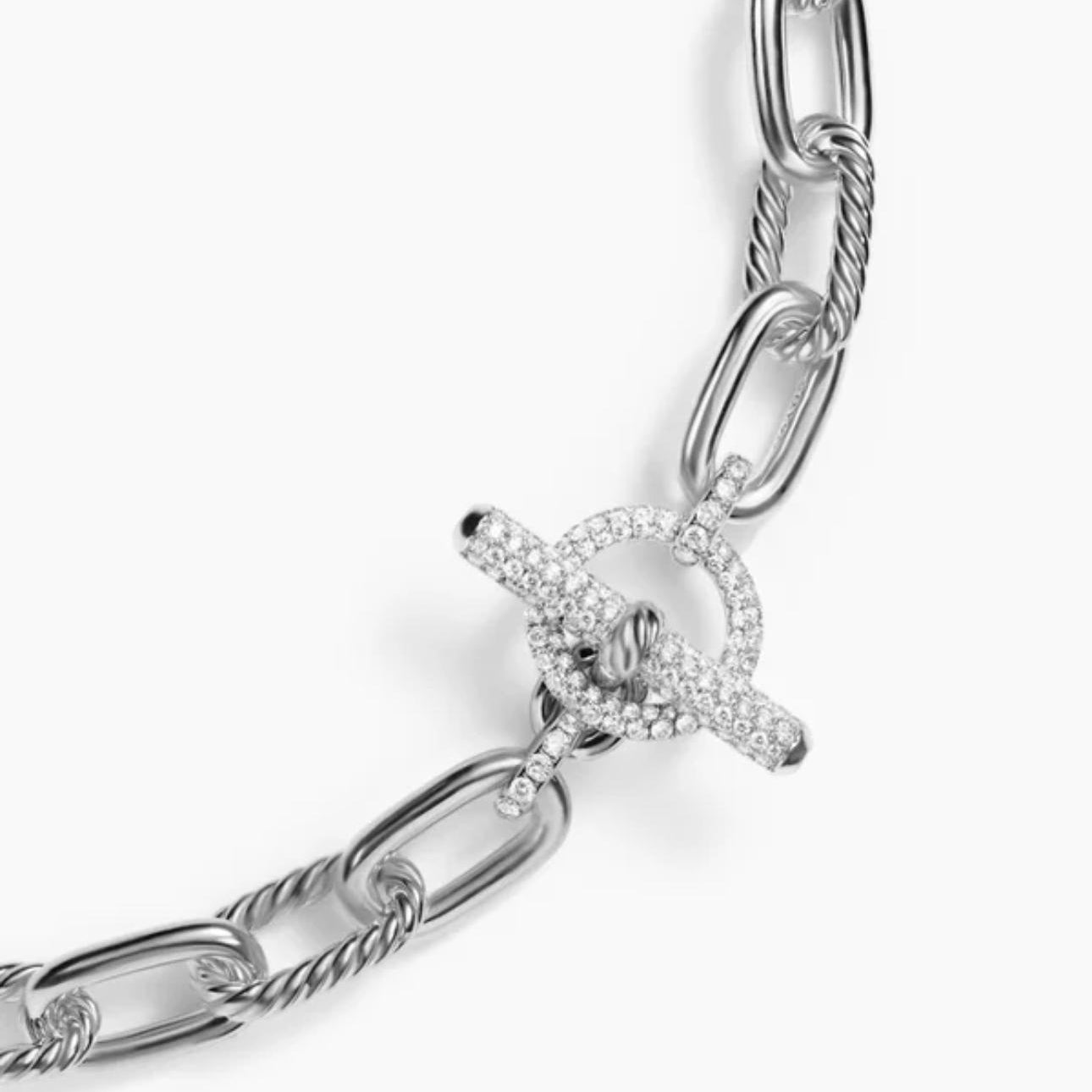 Close up Silver chain bracelet with a Pave Toggle clasp on a white background