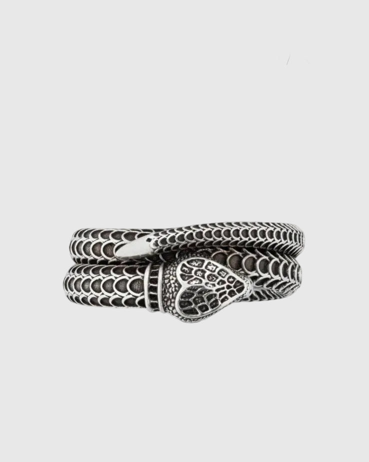 Detailed view of the deeply oxidized engraved scales and the seamless continuous loop of the Aerion Marmont snake ring.