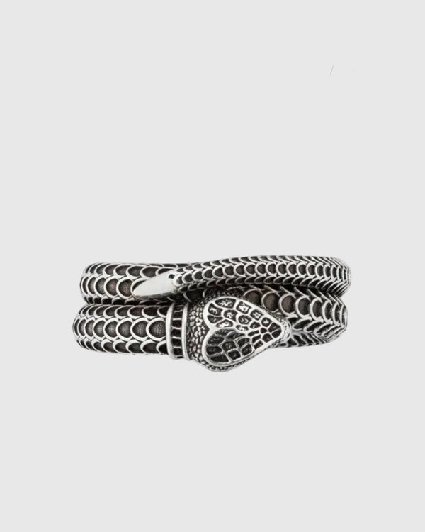 Detailed view of the deeply oxidized engraved scales and the seamless continuous loop of the Aerion Marmont snake ring.