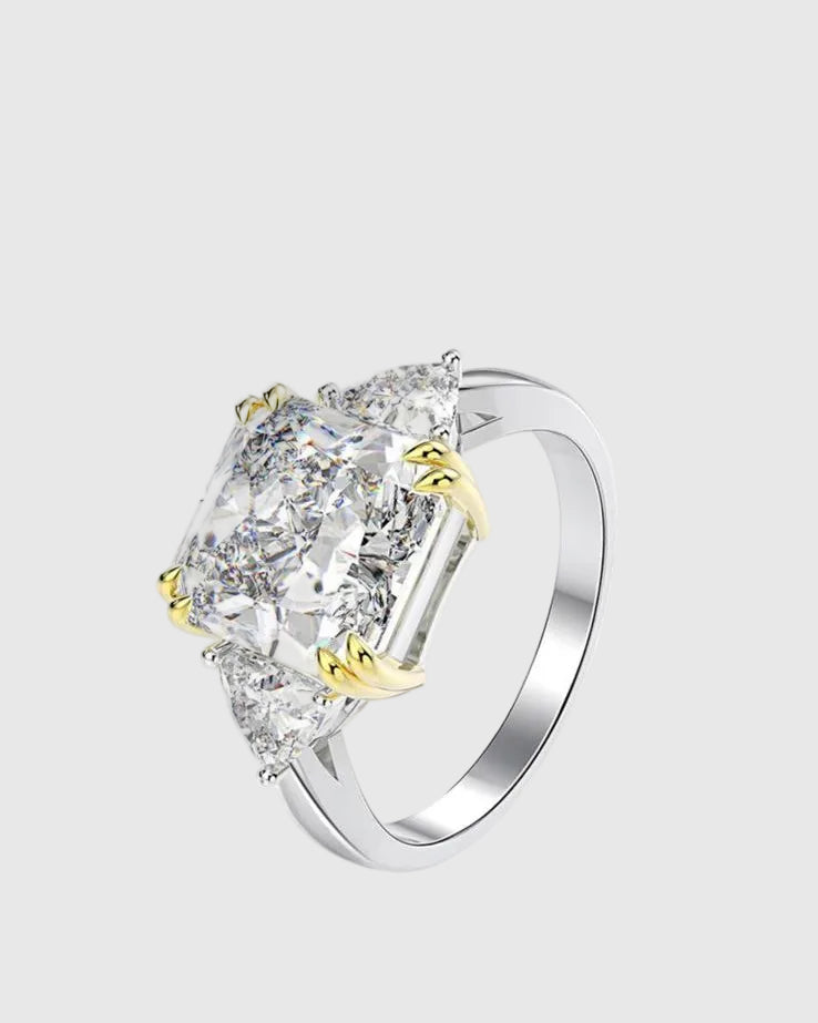 Angled studio shot of the solid Italian 925 silver engagement ring featuring a 4ct D-color princess-cut lab-grown diamond flanked by trillion-cut side stones.