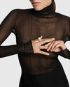 A luxury editorial photo of a model wearing the L’Éthérée peacock feather matching diamond rings, showcasing a quiet luxury aesthetic.