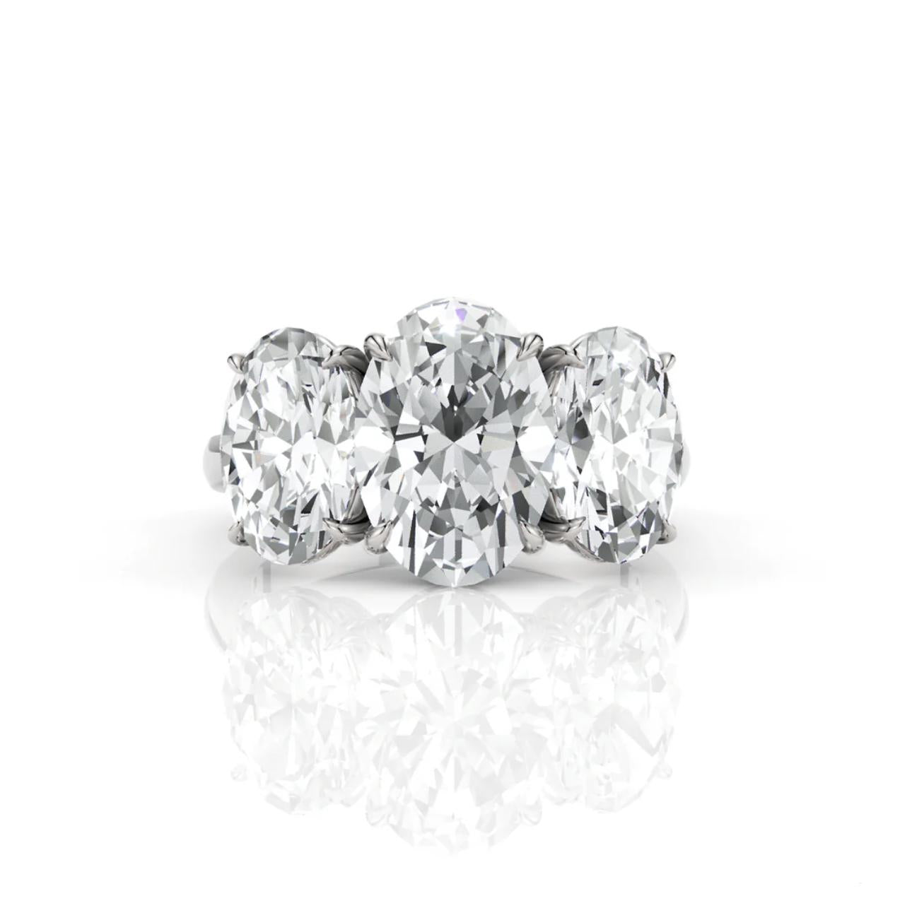 Diamond ring with three large diamonds on a white background