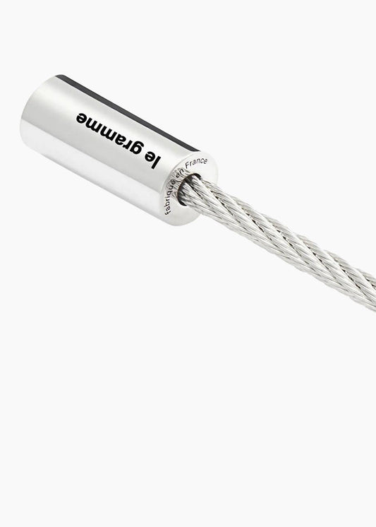 Silver weight with chain and 'Le Grame' branding on a white background