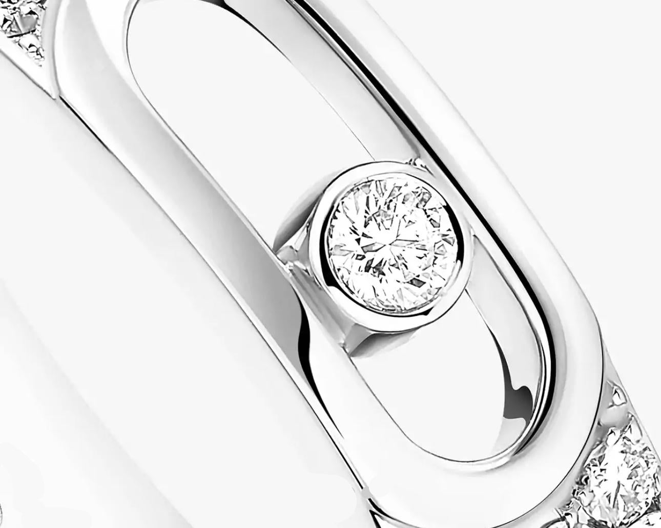 Close-up of a silver ring with a diamond on a white background
