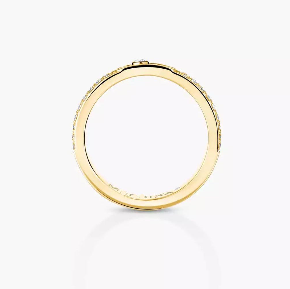 Gold ring with small diamonds on a white background