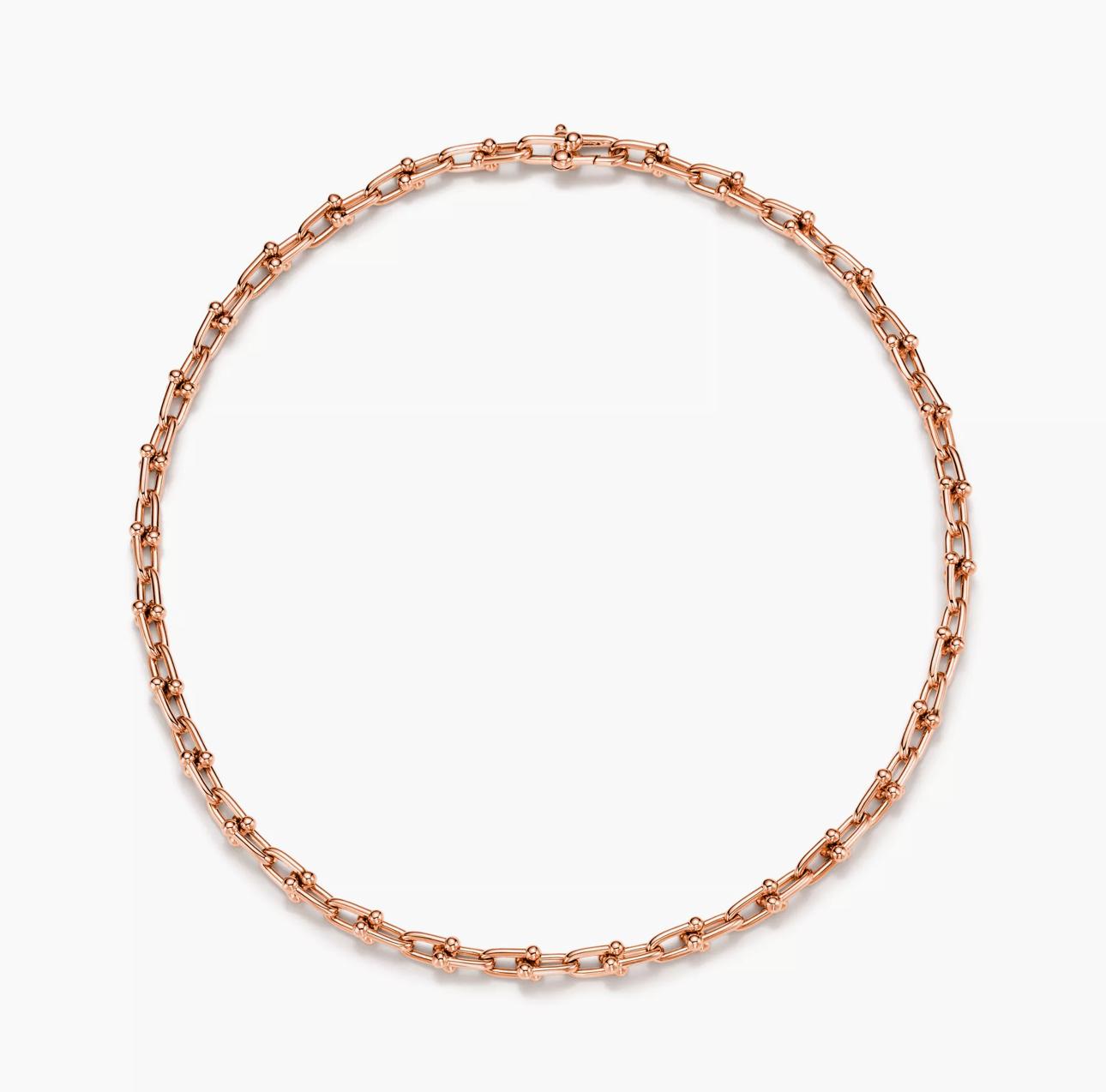 Rose Gold chain Horsebit link design necklace on a white background