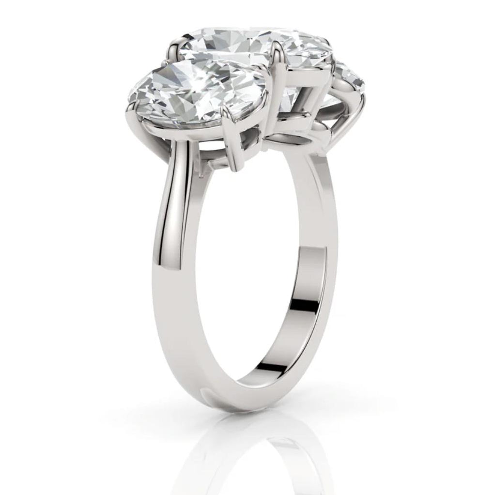 Silver ring with a large diamond on a white background