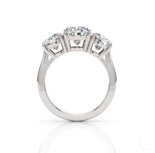 Silver ring with three diamonds on a white background