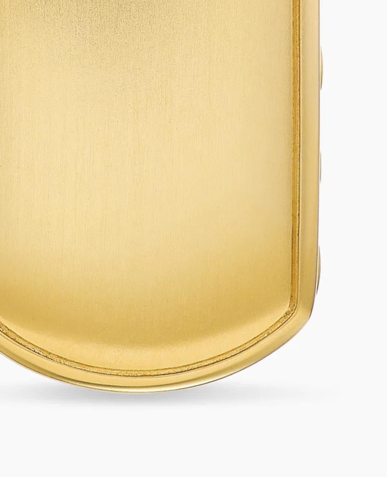 Close-up of the smooth tag pendant back, featuring a polished surface with soft curved edges.
