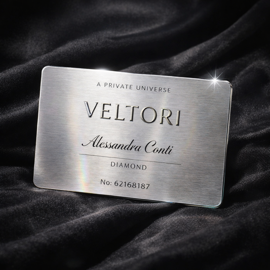 Veltori Diamond Membership platinum metal card with sharp edges on a dark silk background