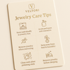 Veltori jewelry care tips card with icons on a beige background