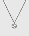 Close-up detail of the sculpted interlocking monogram charm with a twisted rope motif and antiqued oxidized finish.