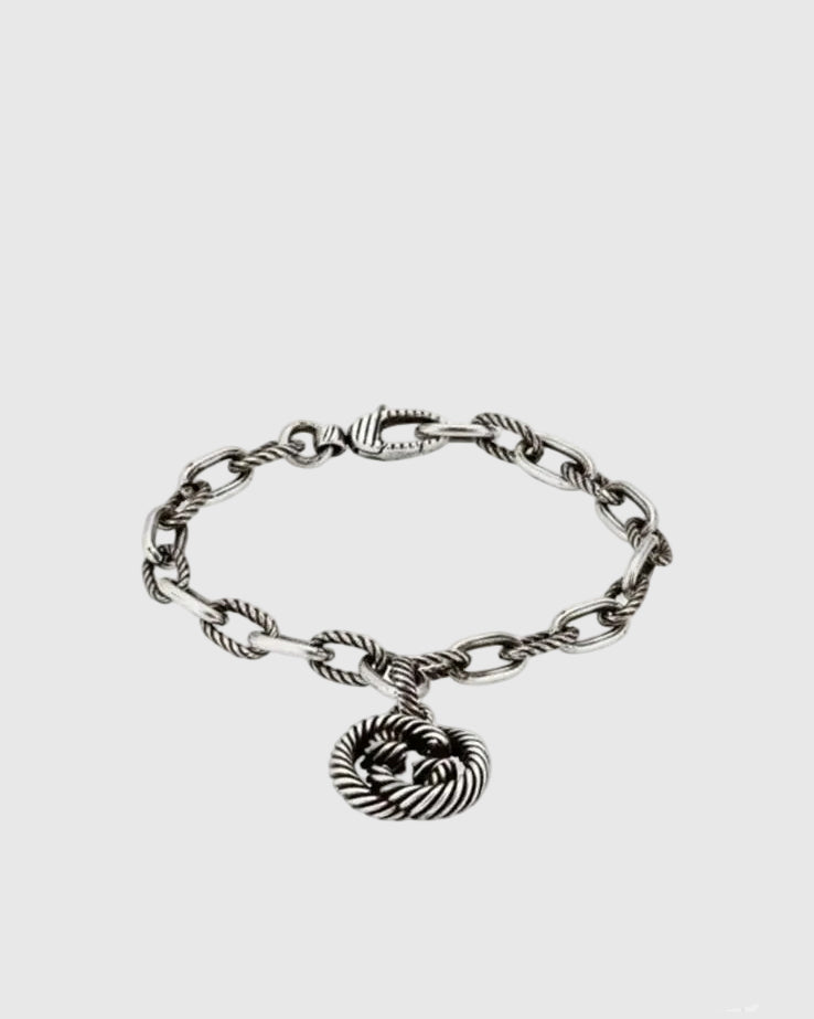 Full studio view of the vintage 925 sterling silver bracelet featuring alternating smooth and twisted rope chain links.
