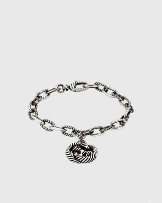 Full studio view of the vintage 925 sterling silver bracelet featuring alternating smooth and twisted rope chain links.