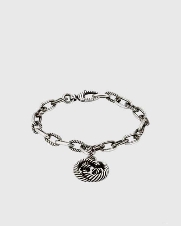 Full studio view of the vintage 925 sterling silver bracelet featuring alternating smooth and twisted rope chain links.