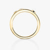 Gold ring with small diamonds on a white background