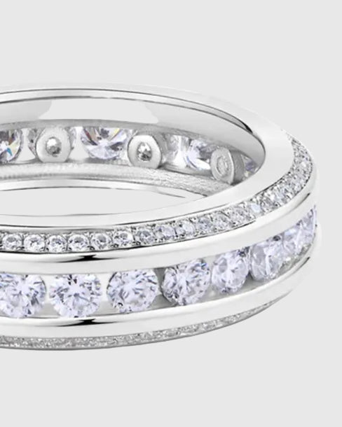 Side profile of the 18K White Gold-plated 925 sterling silver three-row eternity band, detailing the secure channel setting and the smooth comfort-fit interior.