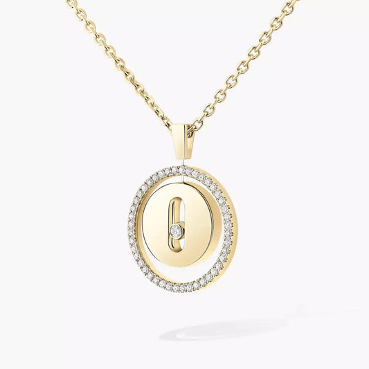 Gold necklace with a round pendant featuring a lock design on a white background