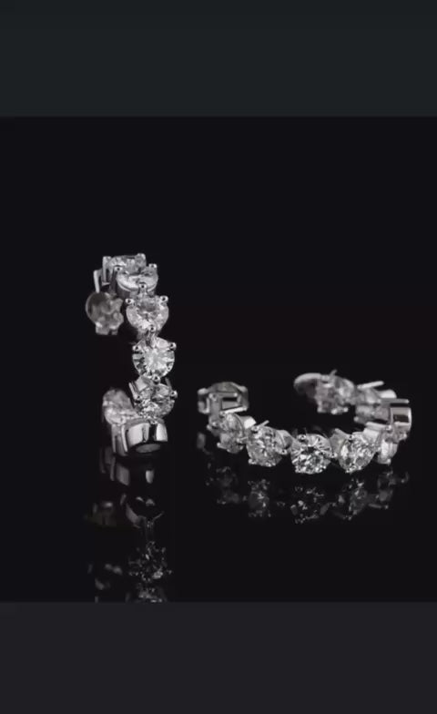 Lumora Radiance moissanite earrings — 925 silver, 18K white gold plating, D color VVS1 stones on black background