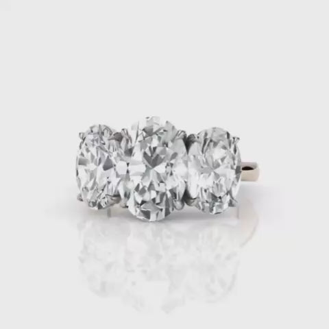 Silver ring with a large diamond on a white background