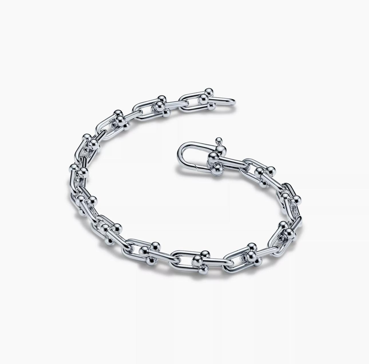 Silver chain bracelet on a white background
