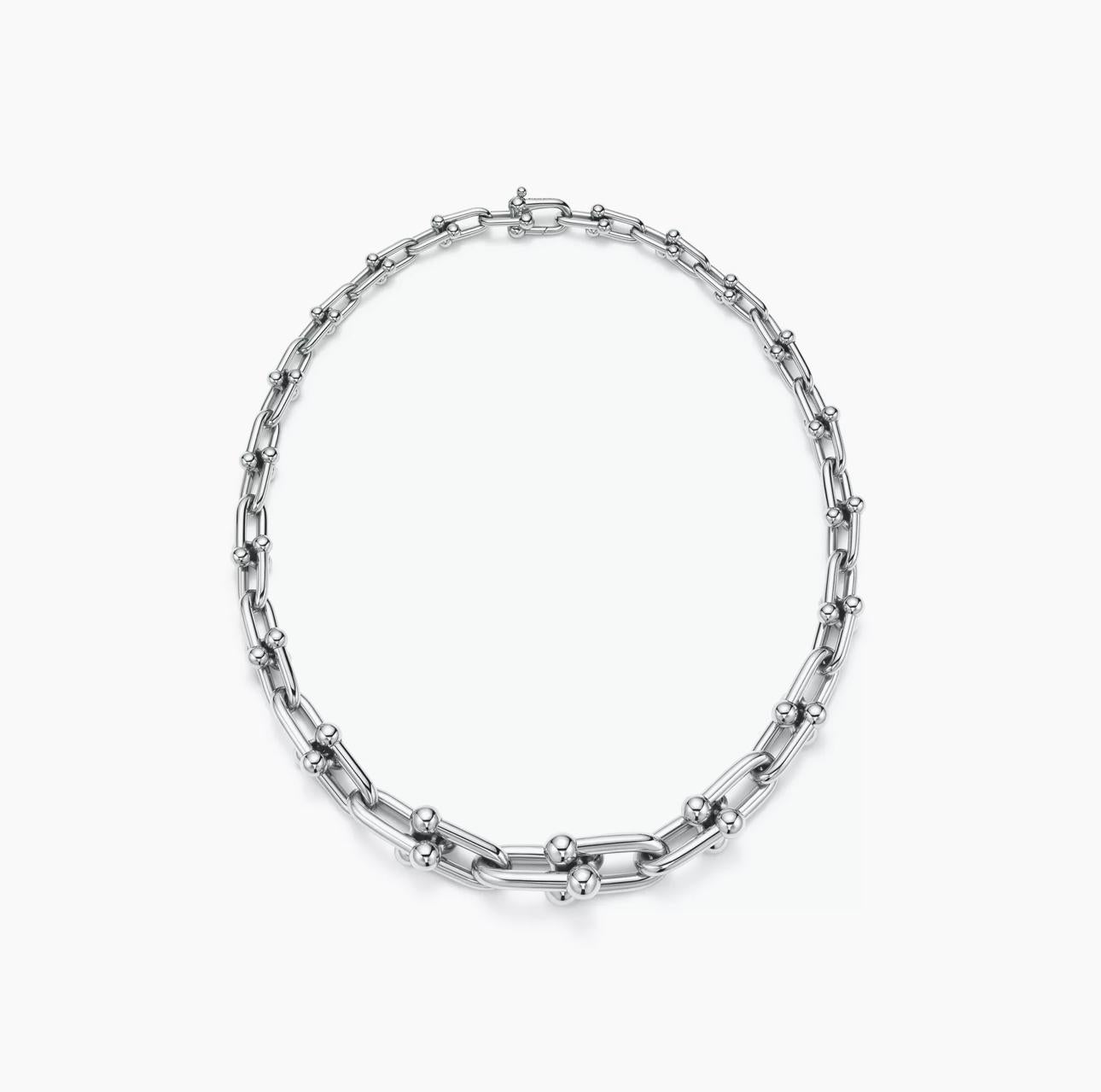 Silver chain necklace on a white background