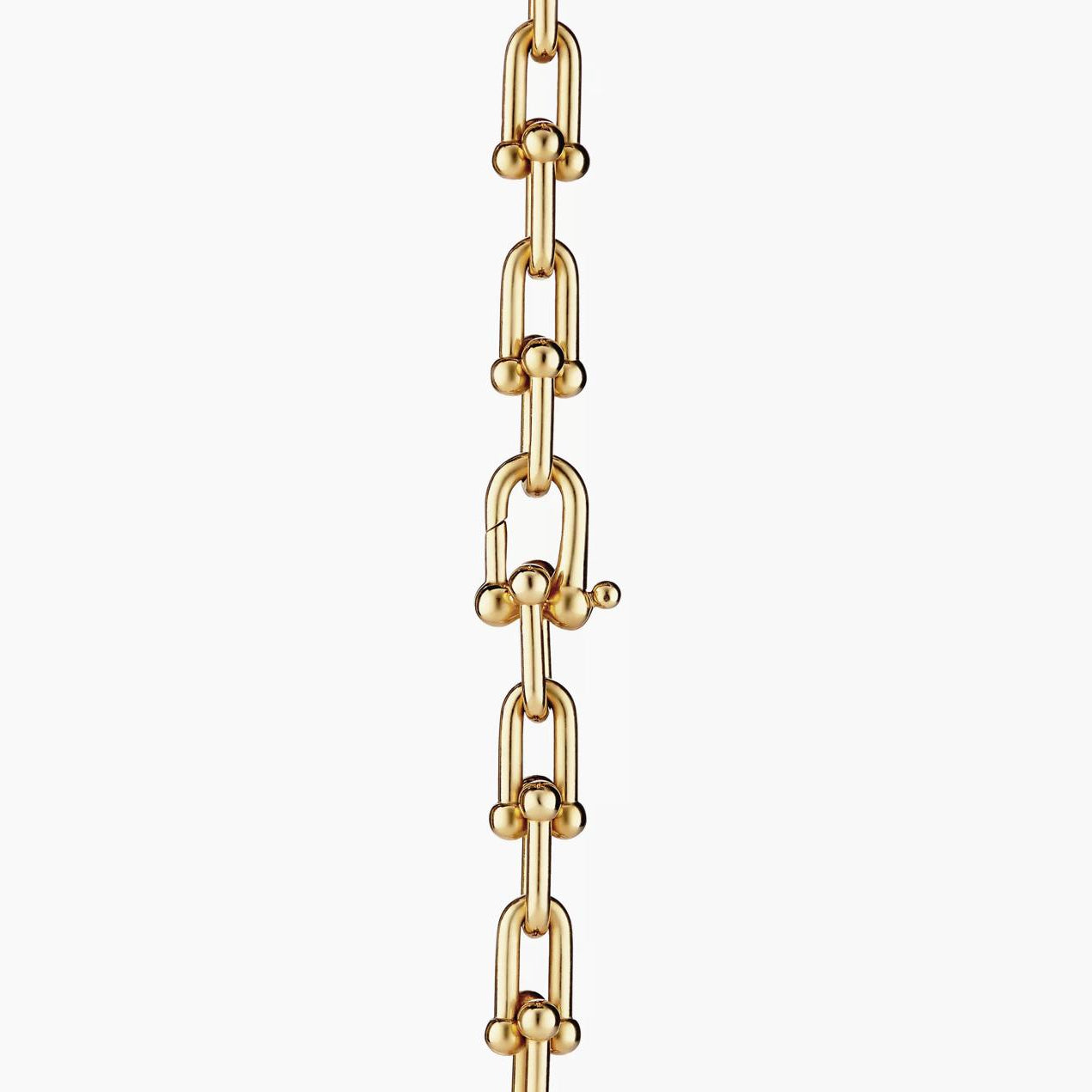 Gold chain necklace on a white background