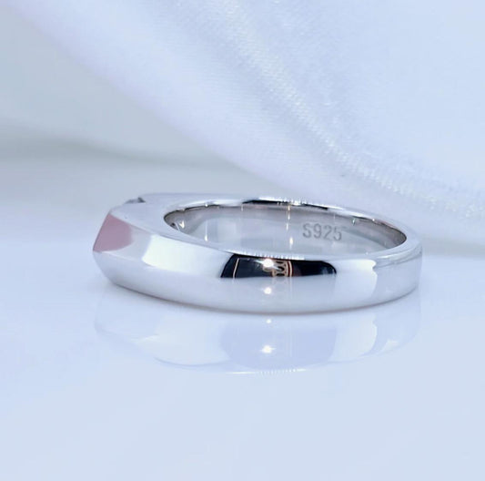 A marquise-cut moissanite ring with a 1ct D-color VVS1 clarity, set in sterling silver and plated in 18K white gold.