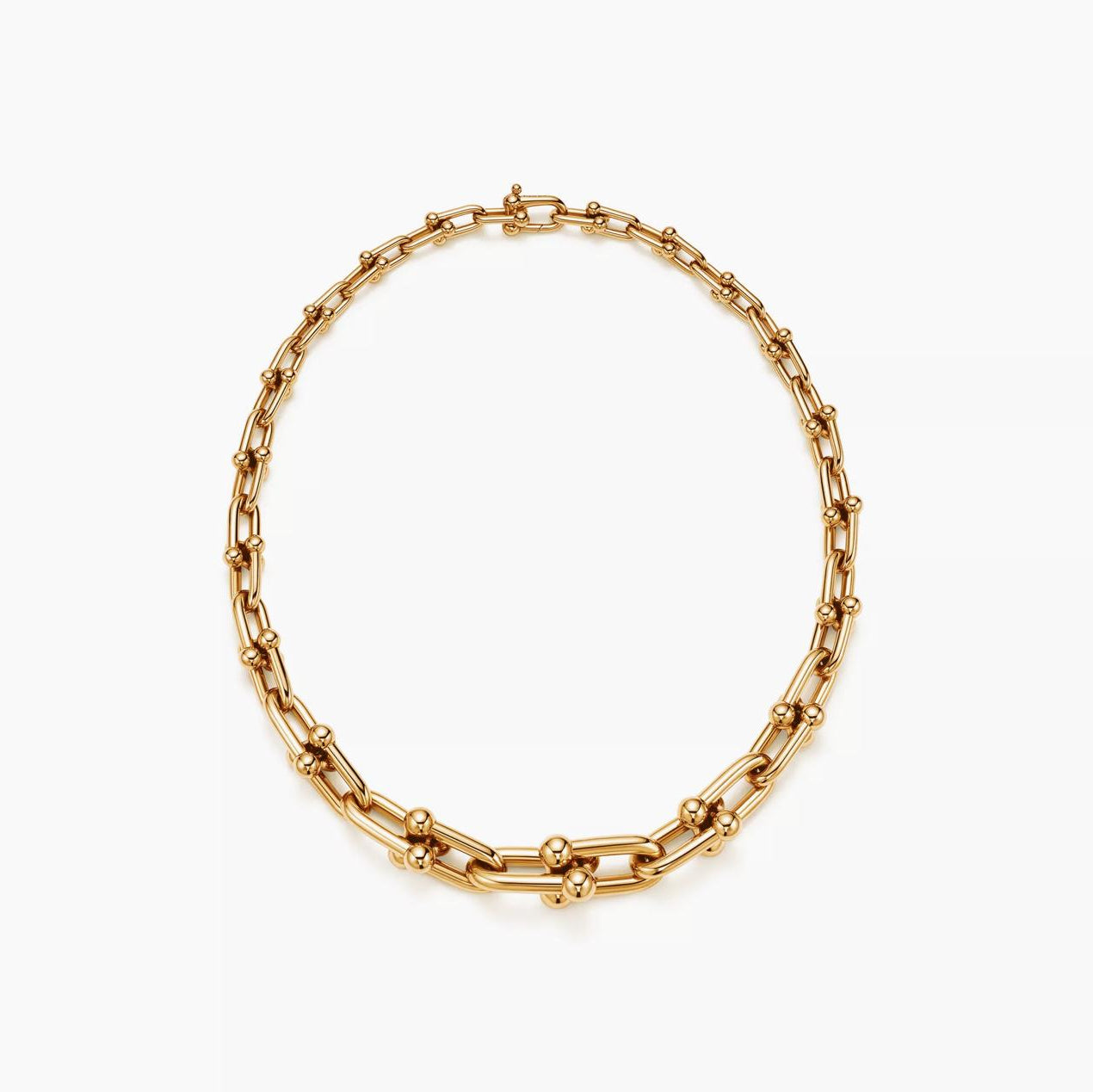 Gold chain necklace on a white background