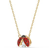 Gold necklace with ladybug motif, featuring a central zircon stone and red and white accents on a gold-tone finish on a white background