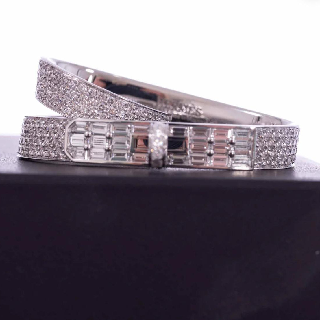 gold ring with diamond accents on a dark surface