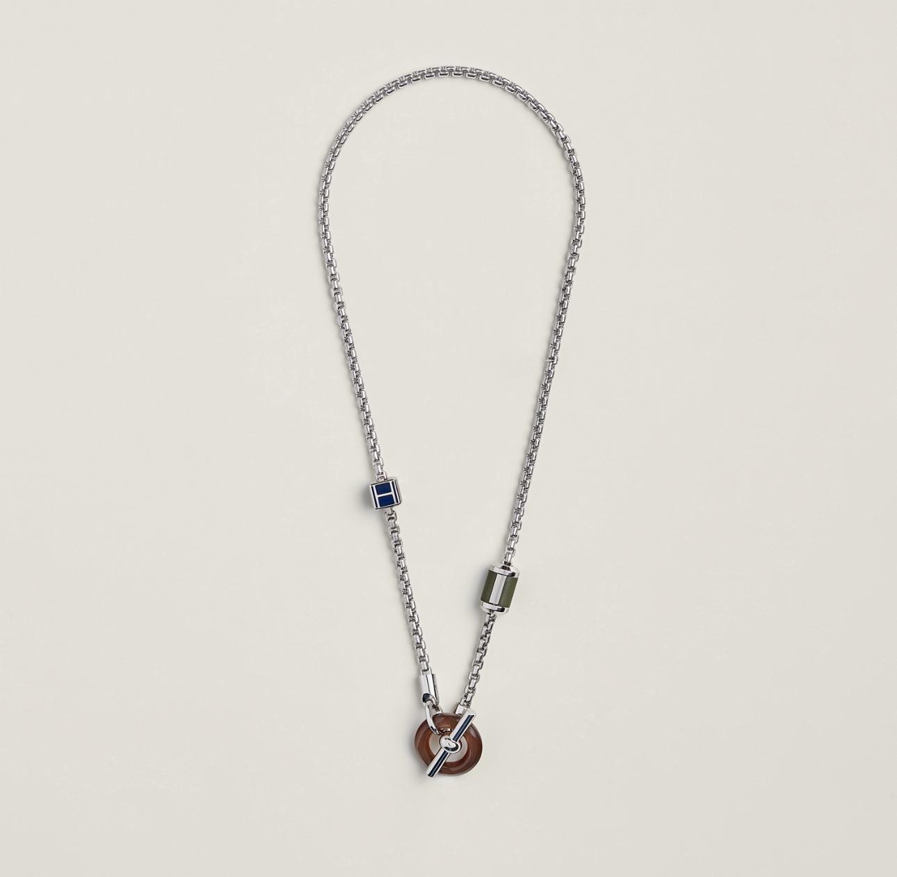 Necklace with a pendant on a light gray background