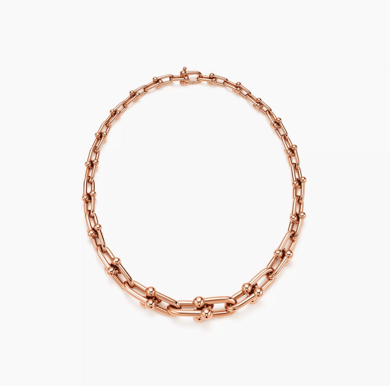 Rose gold chain bracelet on a white background