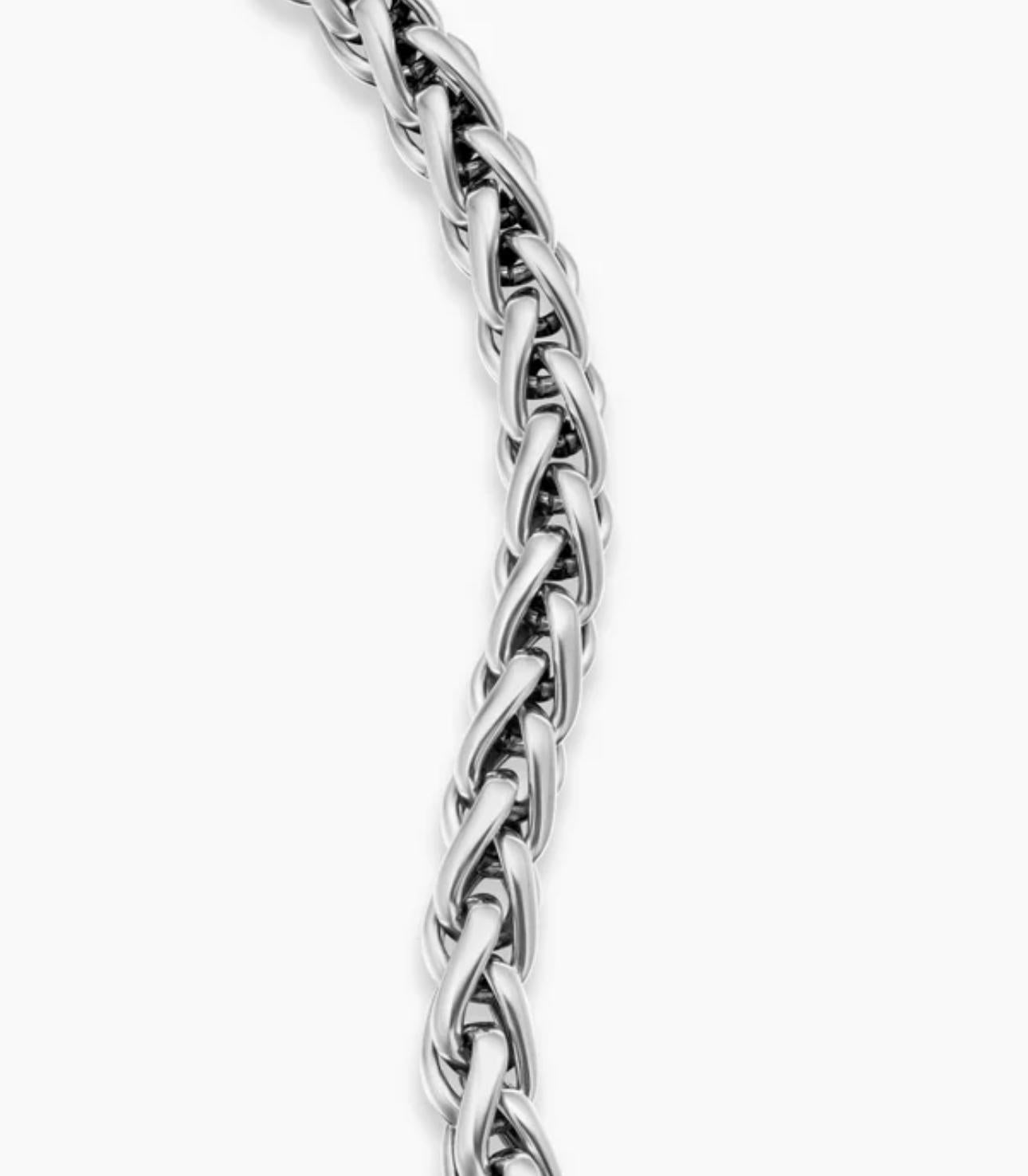Silver braided chain on a white background