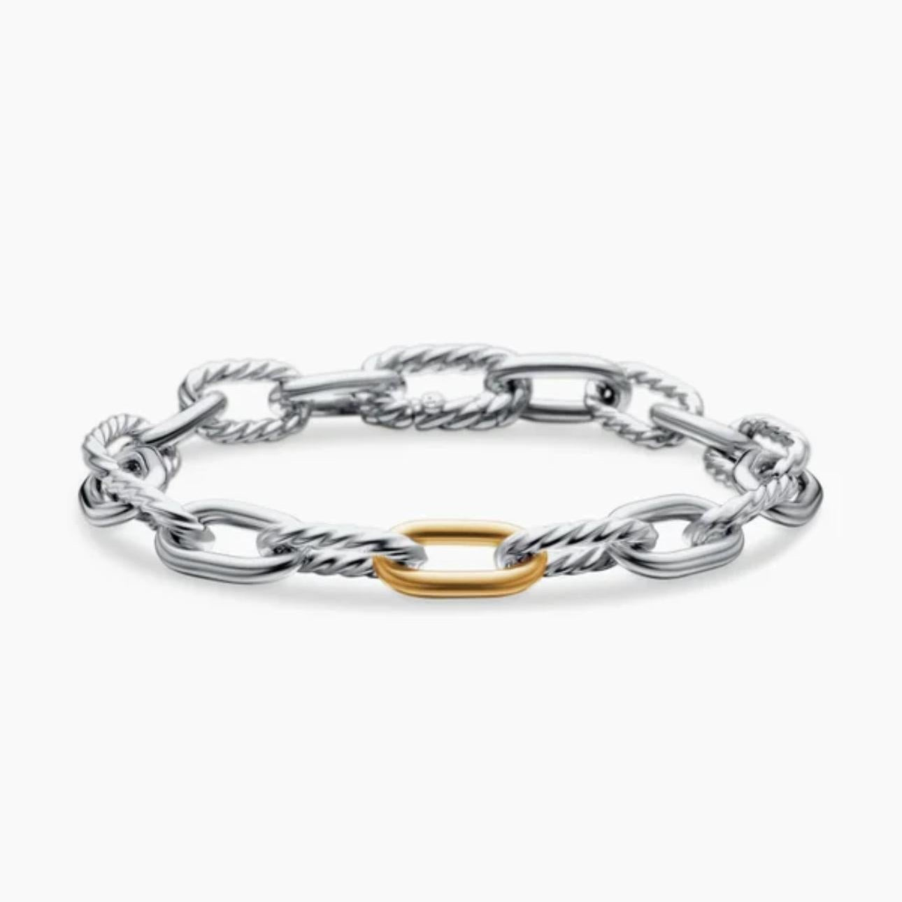 Silver chain bracelet with a gold ring on a white background