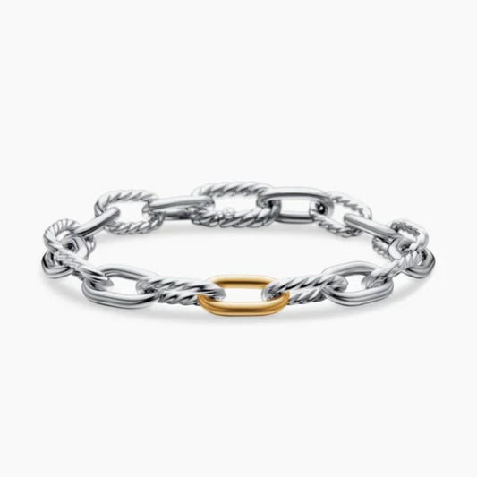 Silver chain bracelet with a gold ring on a white background