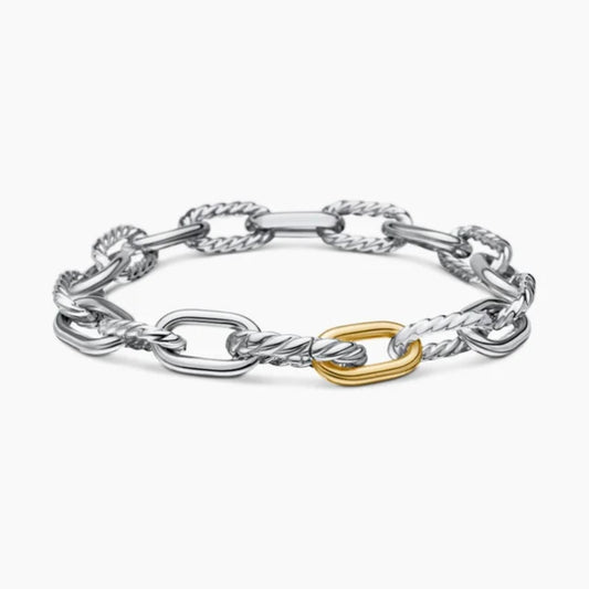 Silver chain bracelet with a gold clasp on a white background