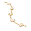Gold bracelet with four-leaf clover charms on a white background