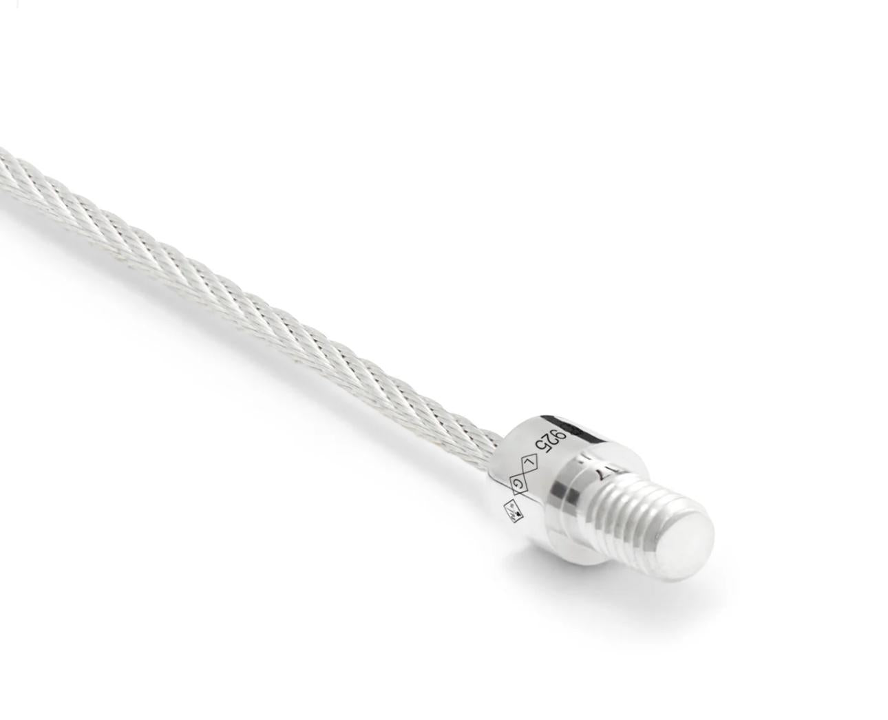 Silver cable with a connector on a white background