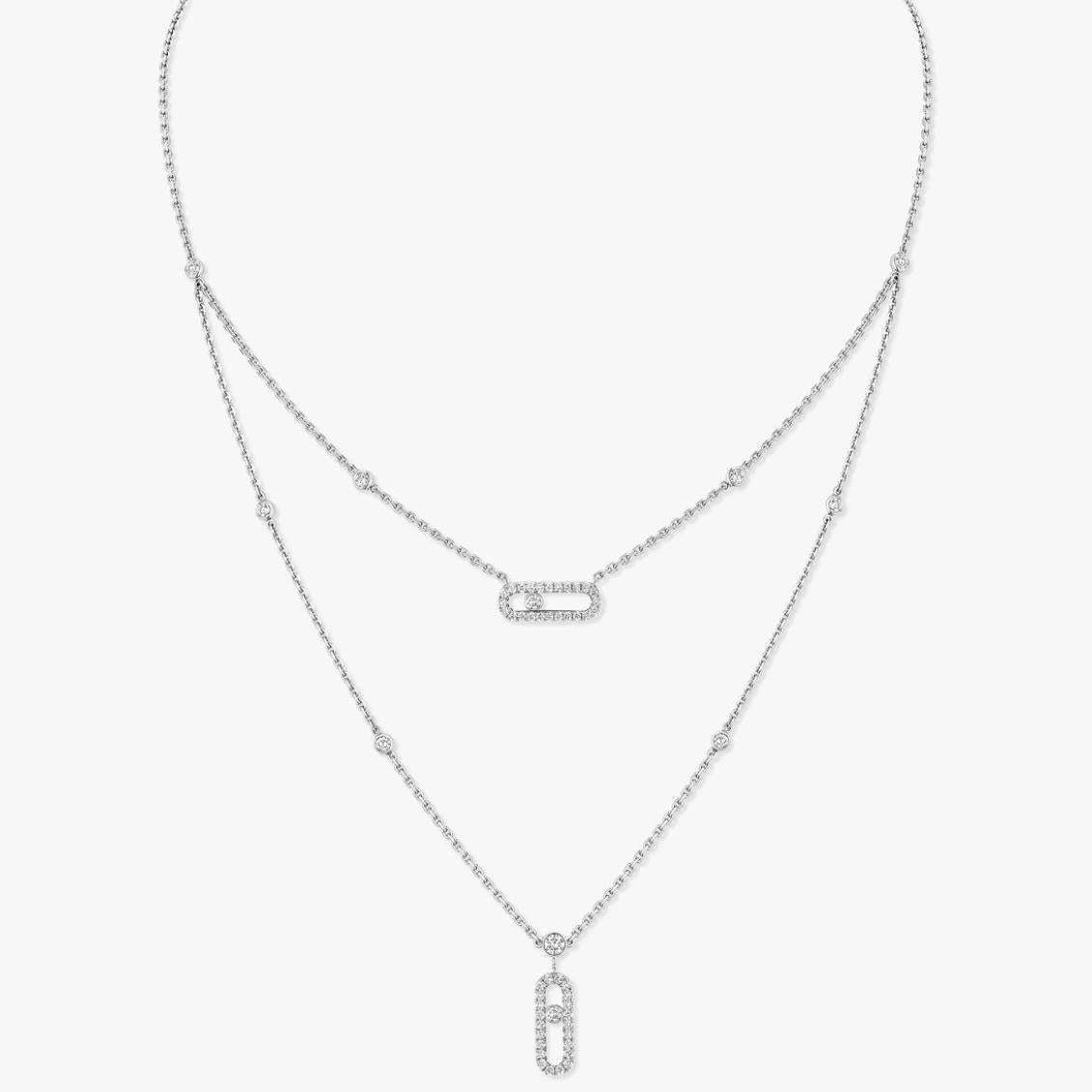 Two silver necklaces with pendants on a light gray background