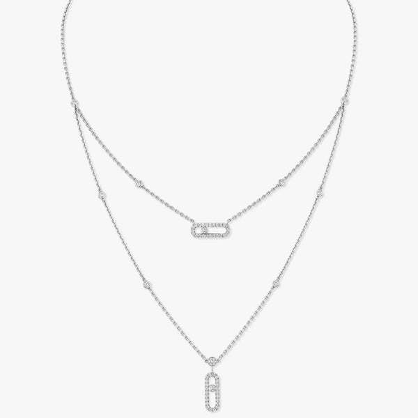 Two silver necklaces with pendants on a light gray background