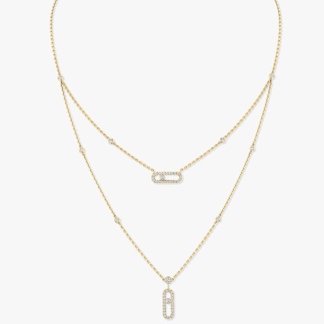 Gold necklace with diamond pendants on a white background