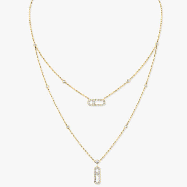 Gold necklace with diamond pendants on a white background