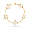 Gold bracelet with four-leaf clover charms on a white background