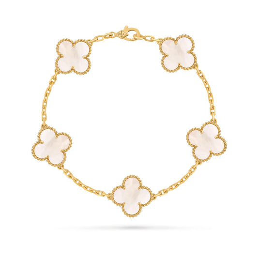 Gold bracelet with four-leaf clover charms on a white background