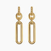 Gold earrings with oval links on a white background