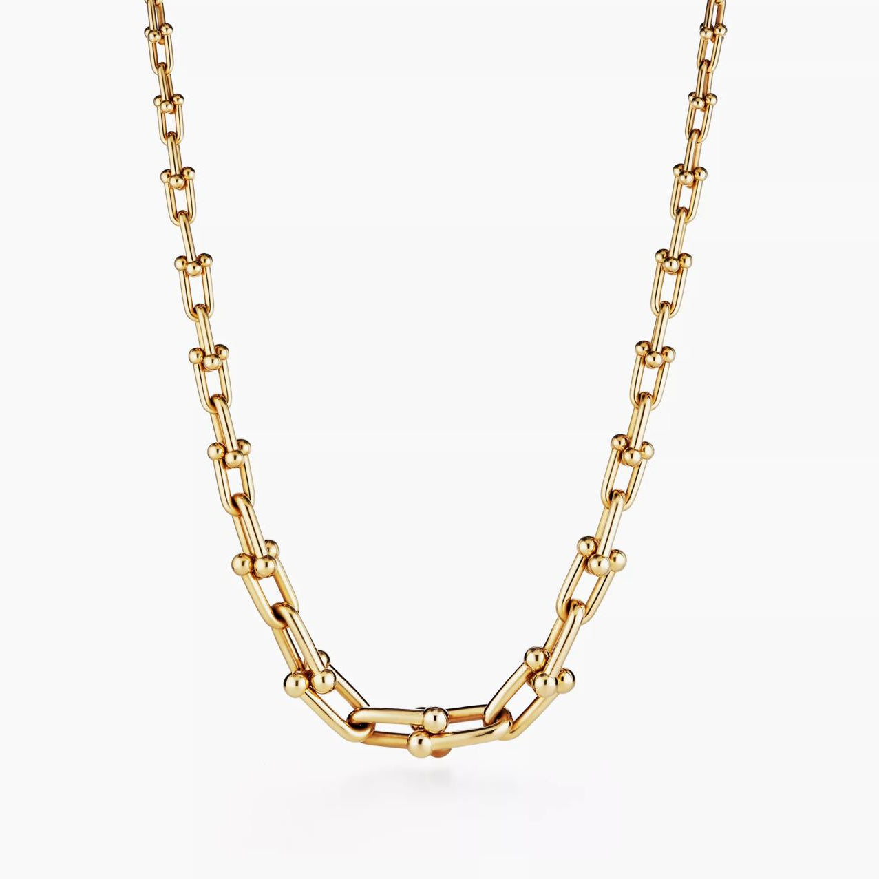 Gold chain necklace on a white background