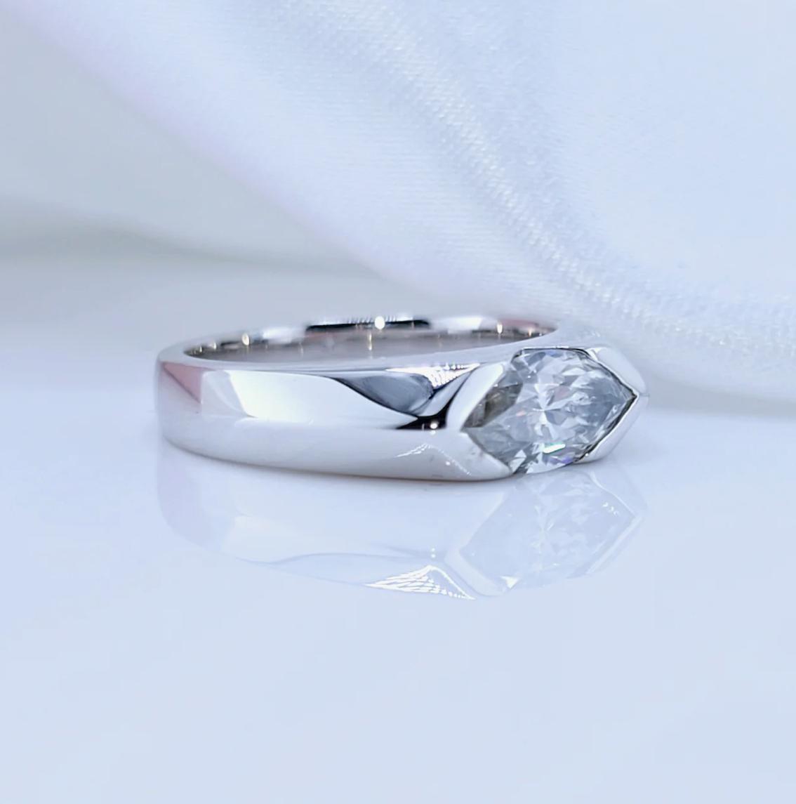 A marquise-cut moissanite ring with a 1ct D-color VVS1 clarity, set in sterling silver and plated in 18K white gold.