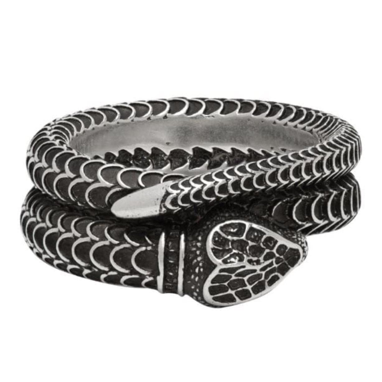 Black and silver snake-shaped ring on a white background
