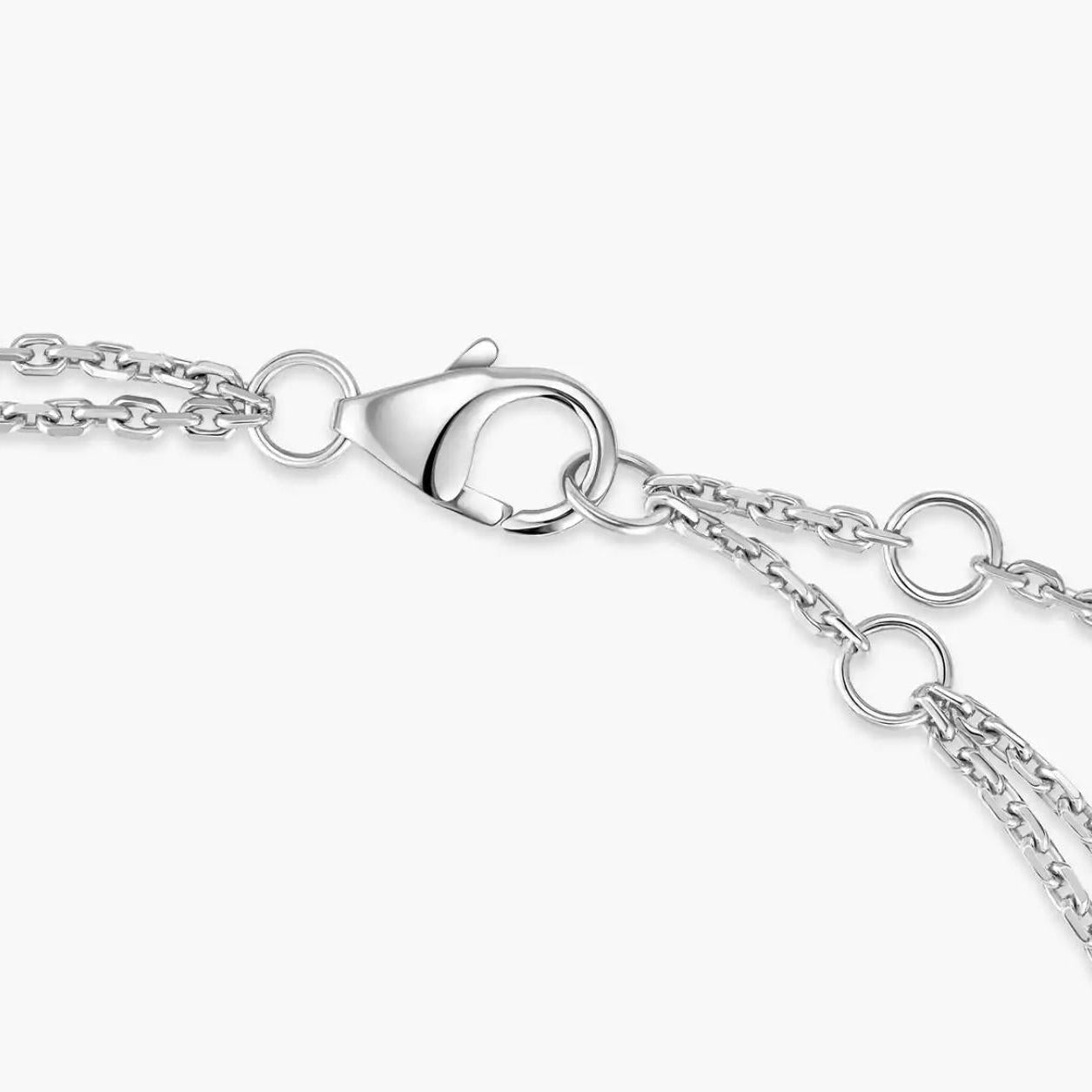Close-up of a silver chain with clasp on a white background